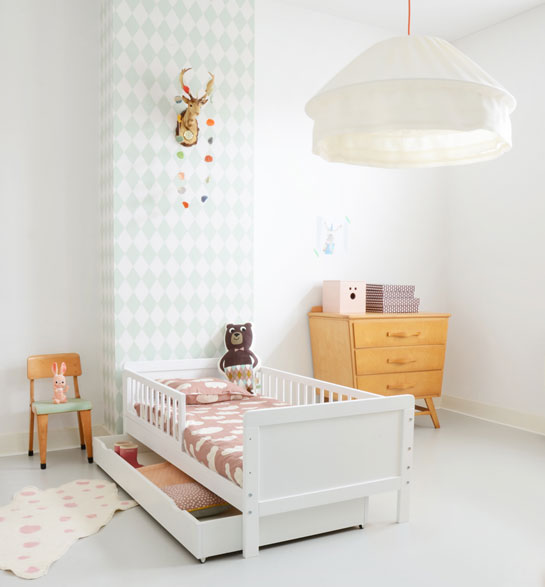 White wooden bed with storage box underneath